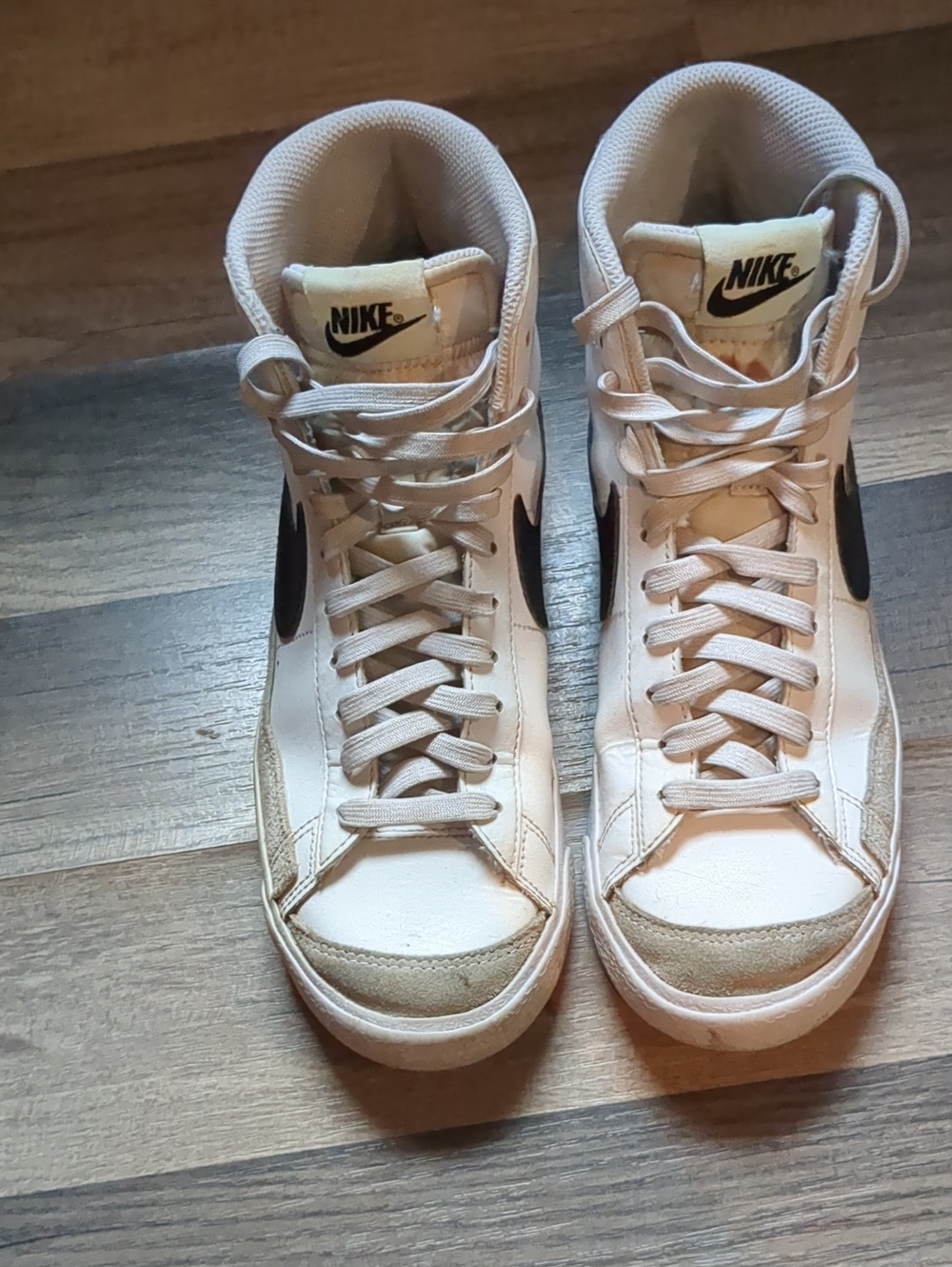 Nike Women's High-Top Sneakers in Off-White with Black Swoosh